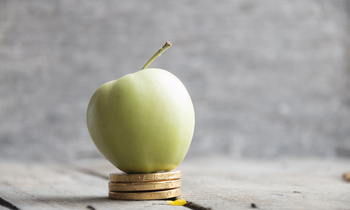 gold coins and apple
